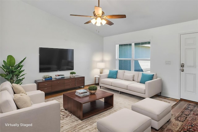 16171 SW 44th Cir, Ocala, FL 34473 - living room featuring vaulted ceiling, light wood-style floors, ceiling fan, and baseboards