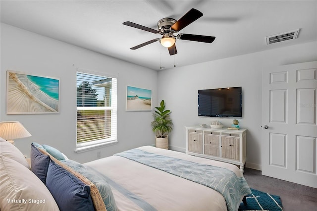 16171 SW 44th Cir, Ocala, FL 34473 - carpeted bedroom with baseboards and ceiling fan