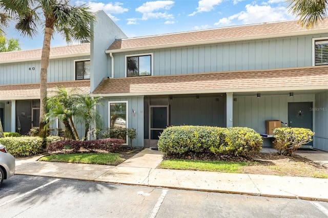 40 Moree Loop Unit 11, Winter Springs, FL 32708 - townhome / multi-family property with roof with shingles