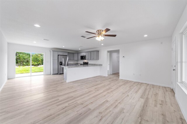 23741 SW Blueberry Ln, Dunnellon, FL 34431 - unfurnished living room featuring recessed lighting, light wood finished floors, and ceiling fan