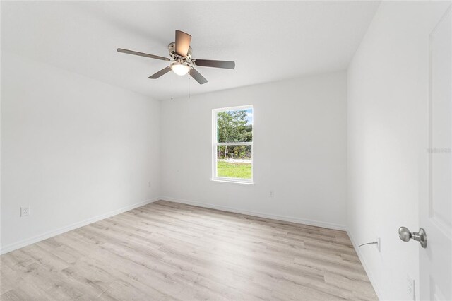 23741 SW Blueberry Ln, Dunnellon, FL 34431 - empty room with ceiling fan and light wood-style floors