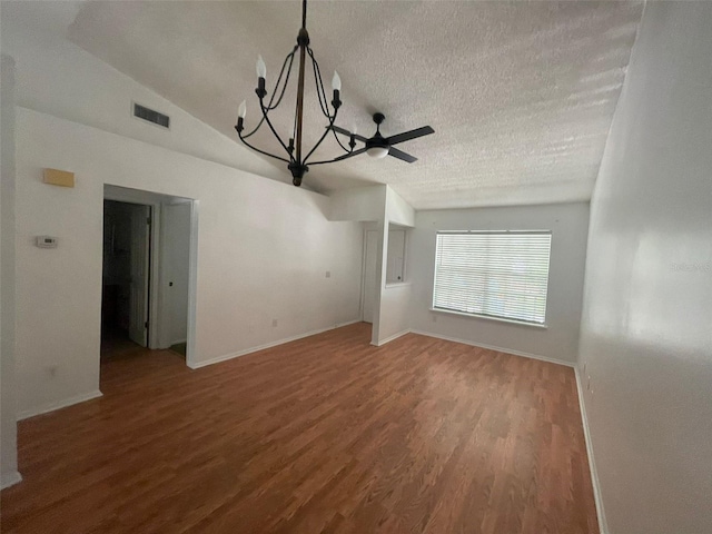 5417 Lake Margaret Dr Unit 39, Orlando, FL 32812 - unfurnished living room featuring visible vents, a notable chandelier, a textured ceiling, wood finished floors, and baseboards