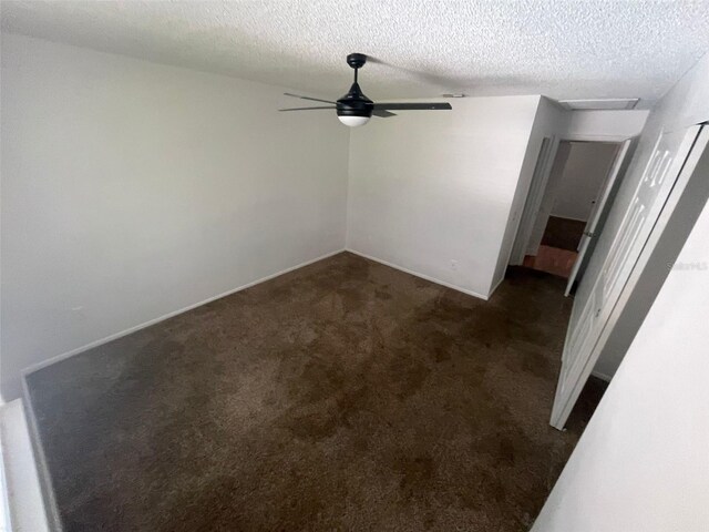5417 Lake Margaret Dr Unit 39, Orlando, FL 32812 - spare room featuring a textured ceiling, ceiling fan, and dark carpet