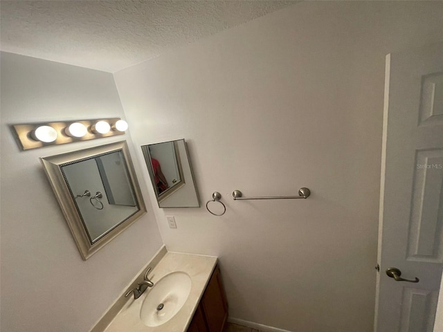 5417 Lake Margaret Dr Unit 39, Orlando, FL 32812 - bathroom with a textured ceiling and vanity