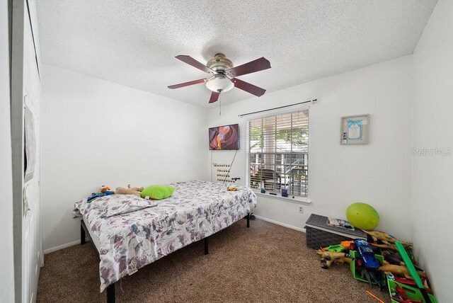 5417 Lake Margaret Dr Unit 39, Orlando, FL 32812 - carpeted bedroom with a textured ceiling and ceiling fan