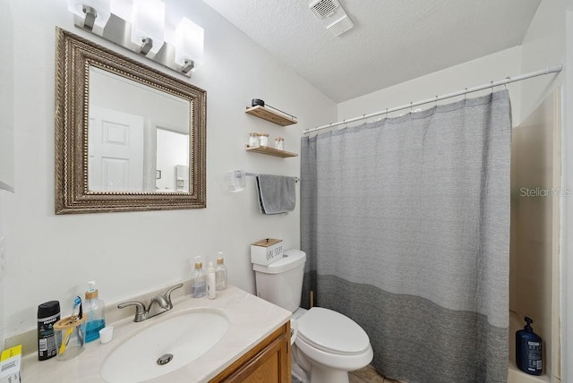 5417 Lake Margaret Dr Unit 39, Orlando, FL 32812 - bathroom featuring vanity, a textured ceiling, and a shower with shower curtain