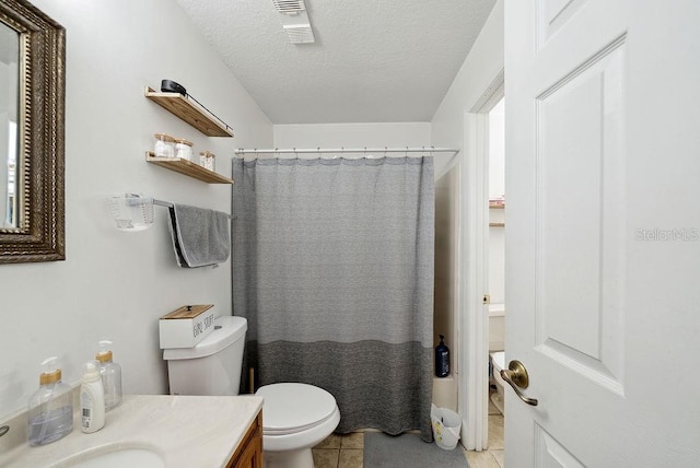 5417 Lake Margaret Dr Unit 39, Orlando, FL 32812 - full bath with tile patterned flooring, vanity, a textured ceiling, and curtained shower