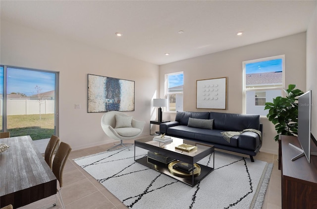 living room with light tile patterned flooring, recessed lighting, and a healthy amount of sunlight