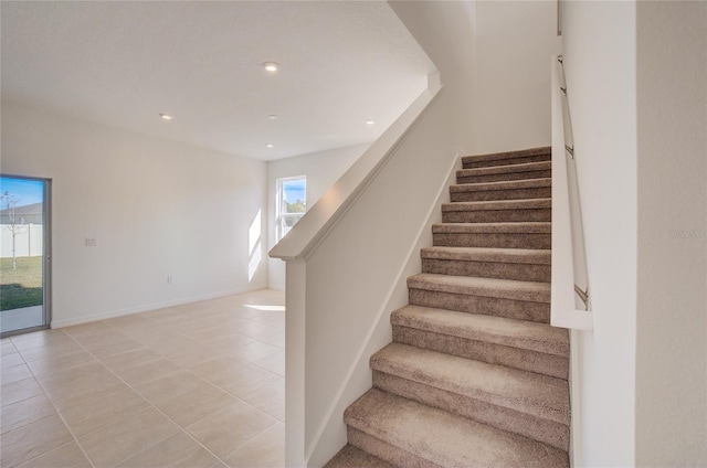 staircase with tile patterned flooring, recessed lighting, and baseboards