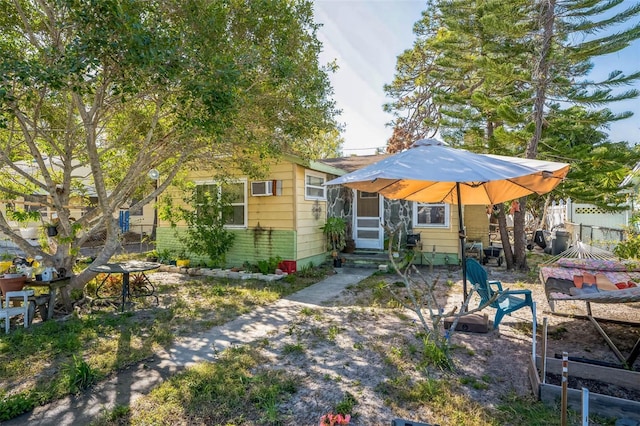 5224 29th Ave S, Gulfport, FL 33707 - rear view of house featuring entry steps and fence