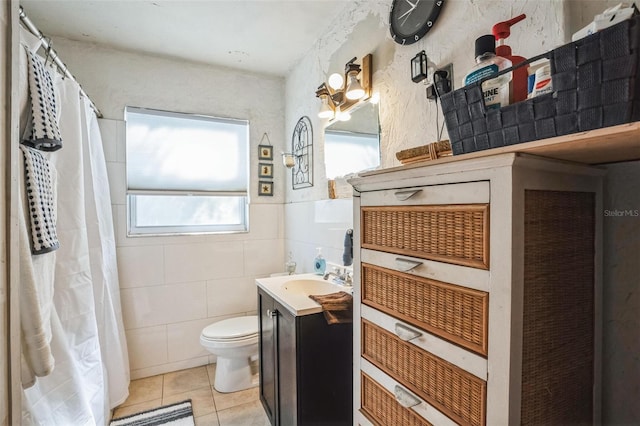 5224 29th Ave S, Gulfport, FL 33707 - full bath with vanity, tile patterned floors, toilet, and tile walls