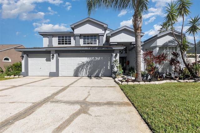 3244 Amaca Cir, Orlando, FL 32837 - view of front facade featuring stucco siding, driveway, a garage, and a front lawn