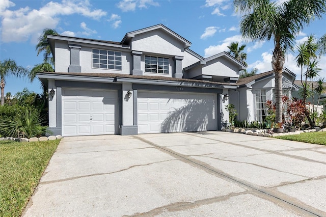 3244 Amaca Cir, Orlando, FL 32837 - traditional-style home with stucco siding, driveway, and a garage