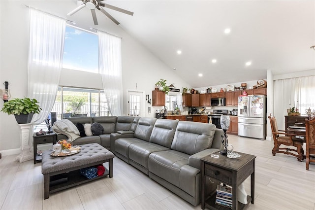 3244 Amaca Cir, Orlando, FL 32837 - living room with high vaulted ceiling, a ceiling fan, and recessed lighting