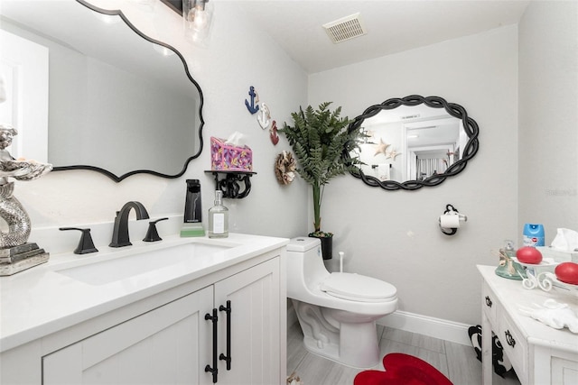 3244 Amaca Cir, Orlando, FL 32837 - bathroom featuring toilet, vanity, and baseboards