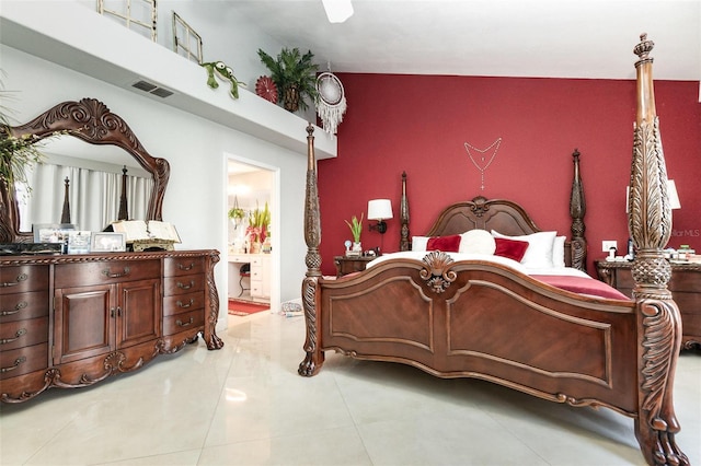 3244 Amaca Cir, Orlando, FL 32837 - bedroom featuring an accent wall and ensuite bath