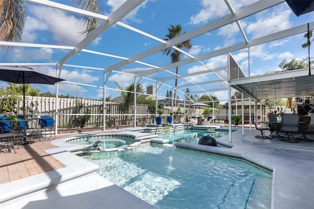 3244 Amaca Cir, Orlando, FL 32837 - view of pool featuring a pool with connected hot tub, a fenced backyard, a patio, and glass enclosure