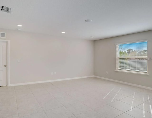 spare room with recessed lighting, visible vents, baseboards, and light tile patterned floors