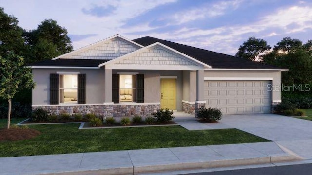 craftsman house with a front yard, an attached garage, stucco siding, concrete driveway, and stone siding