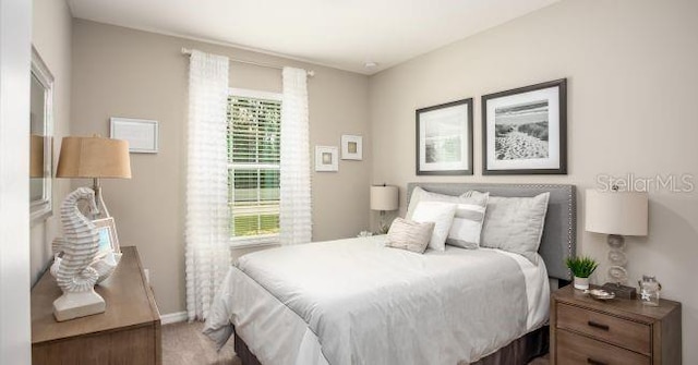 2349 Broadpoint Dr, Punta Gorda, FL 33983 - carpeted bedroom featuring baseboards
