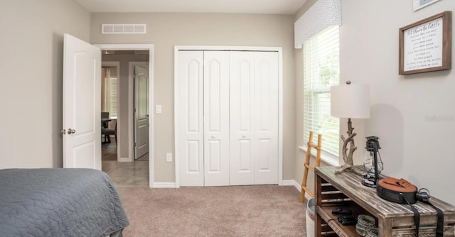 2349 Broadpoint Dr, Punta Gorda, FL 33983 - bedroom with a closet, visible vents, carpet flooring, and baseboards