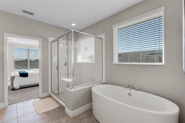 ensuite bathroom featuring visible vents, a soaking tub, a stall shower, tile patterned floors, and connected bathroom