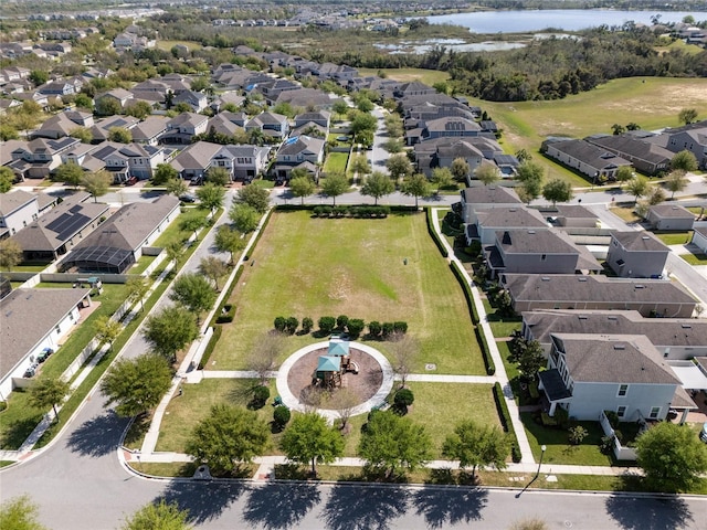 aerial view featuring a residential view and a water view