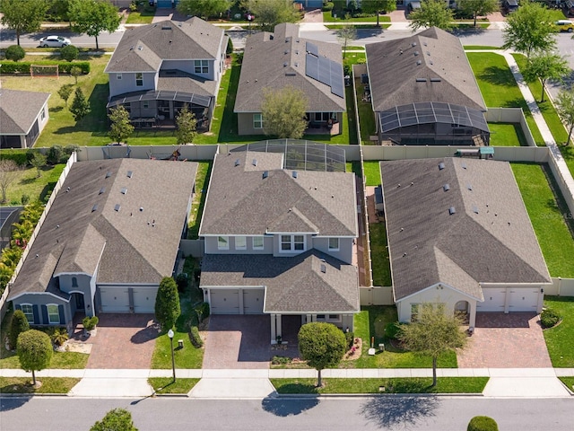 birds eye view of property with a residential view
