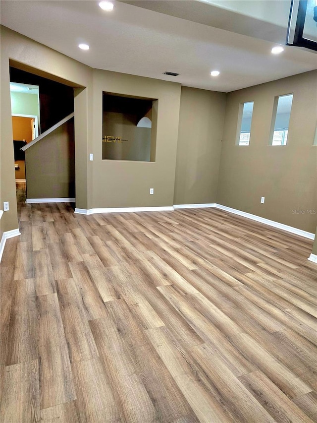 25012 Chipshot Ct, Sorrento, FL 32776 - spare room with wood finished floors, baseboards, and recessed lighting