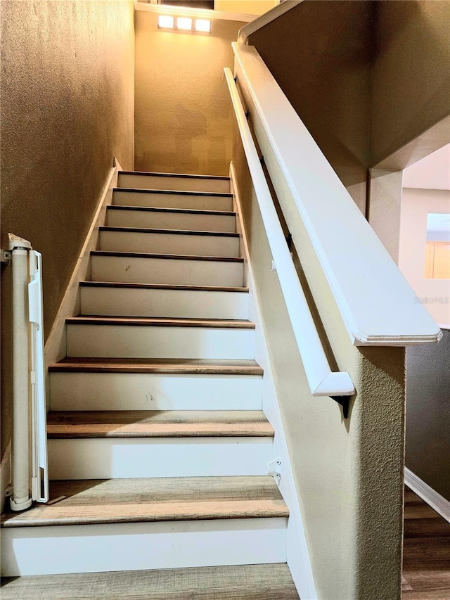 25012 Chipshot Ct, Sorrento, FL 32776 - staircase with wood finished floors
