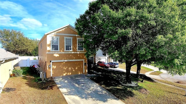 25012 Chipshot Ct, Sorrento, FL 32776 - view of front facade featuring concrete driveway, a garage, and stucco siding