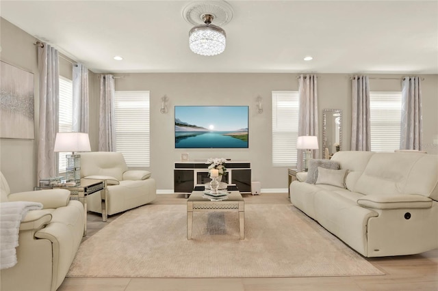 living area with recessed lighting and baseboards