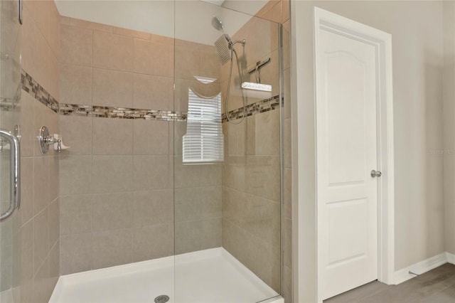 full bath with a shower stall