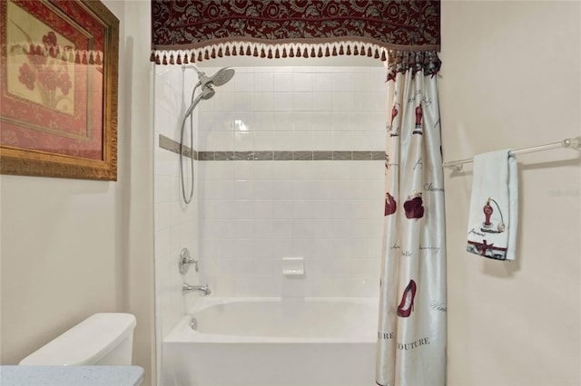 bathroom with toilet and shower / tub combo with curtain