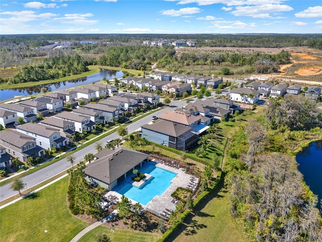 bird's eye view featuring a residential view and a water view