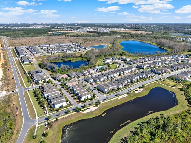 bird's eye view featuring a water view and a residential view