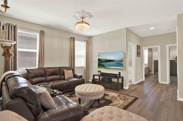 living room with baseboards and wood finished floors