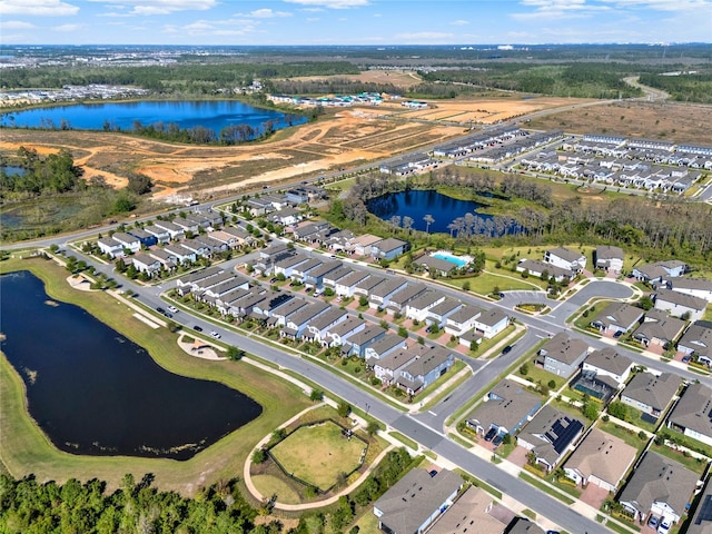 aerial view with a residential view and a water view