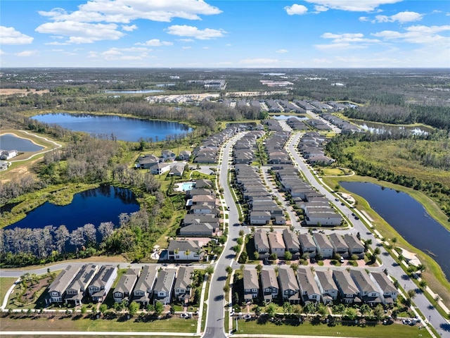 birds eye view of property featuring a water view and a residential view