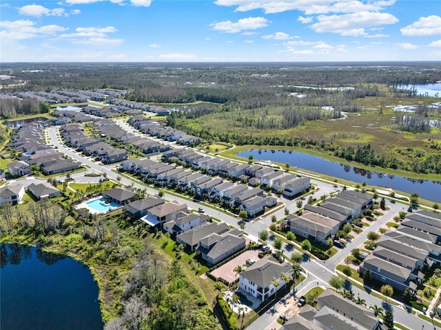 bird's eye view with a water view and a residential view