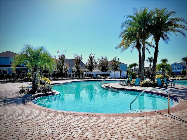 4562 Tribute Trl, Kissimmee, FL 34746 - community pool with a patio