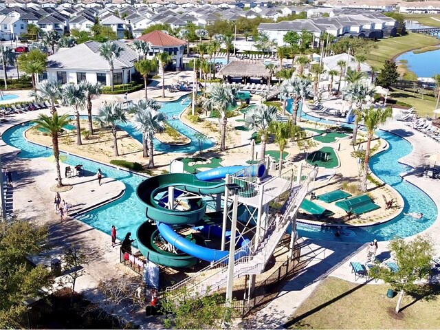 4562 Tribute Trl, Kissimmee, FL 34746 - aerial perspective of suburban area featuring a pool area