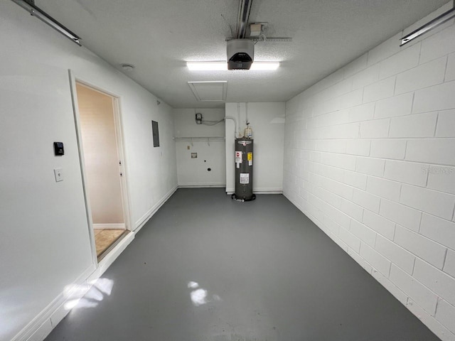 garage with a garage door opener and electric water heater