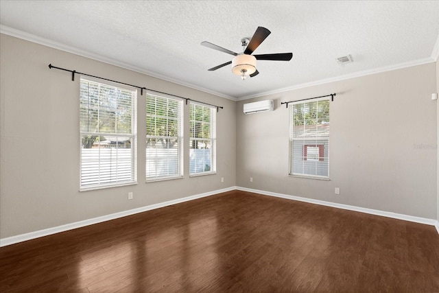 unfurnished room featuring dark wood-type flooring, ceiling fan, an AC wall unit, and a healthy amount of sunlight