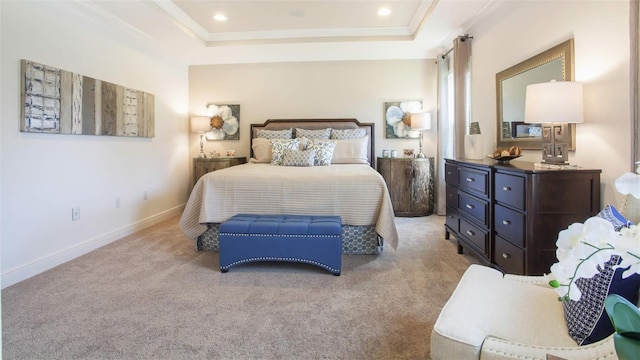 bedroom with a raised ceiling, carpet flooring, baseboards, and ornamental molding