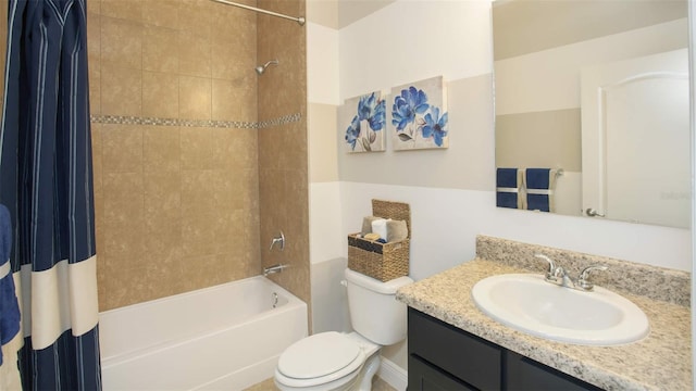 full bathroom with shower / tub combo with curtain, vanity, and toilet