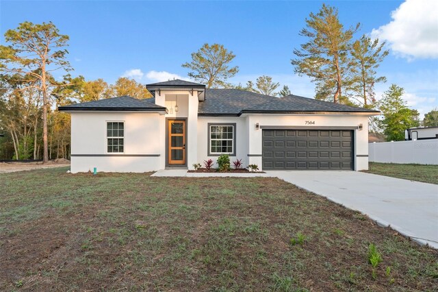 7564 N Gims Way, Citrus Springs, FL 34433 - prairie-style house featuring driveway, stucco siding, and an attached garage