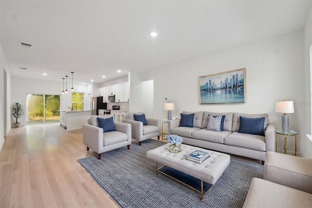 7564 N Gims Way, Citrus Springs, FL 34433 - living area featuring light wood-type flooring and recessed lighting