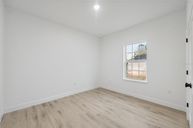 7564 N Gims Way, Citrus Springs, FL 34433 - empty room with light wood finished floors, baseboards, and recessed lighting