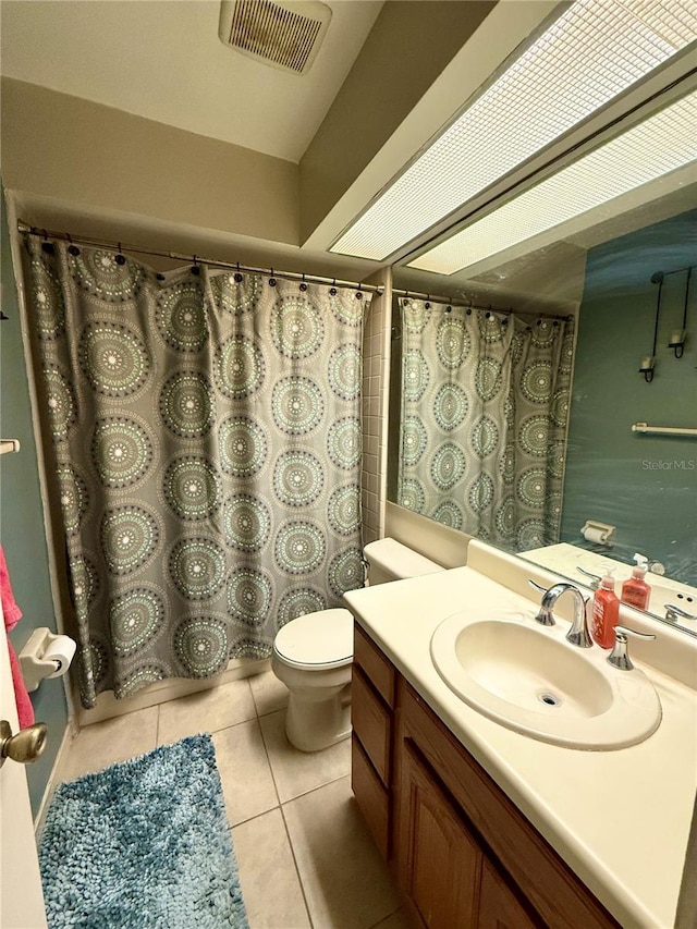 1886 Saint Andrews Pl Unit 1886, Longwood, FL 32779 - full bathroom with tile patterned floors, vanity, toilet, and curtained shower